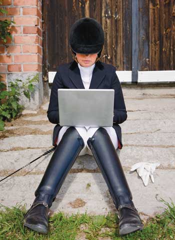 Rider in Show Clothes on Computer