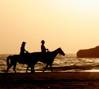 Riding on the beach