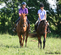 Mother and daughter on horseback