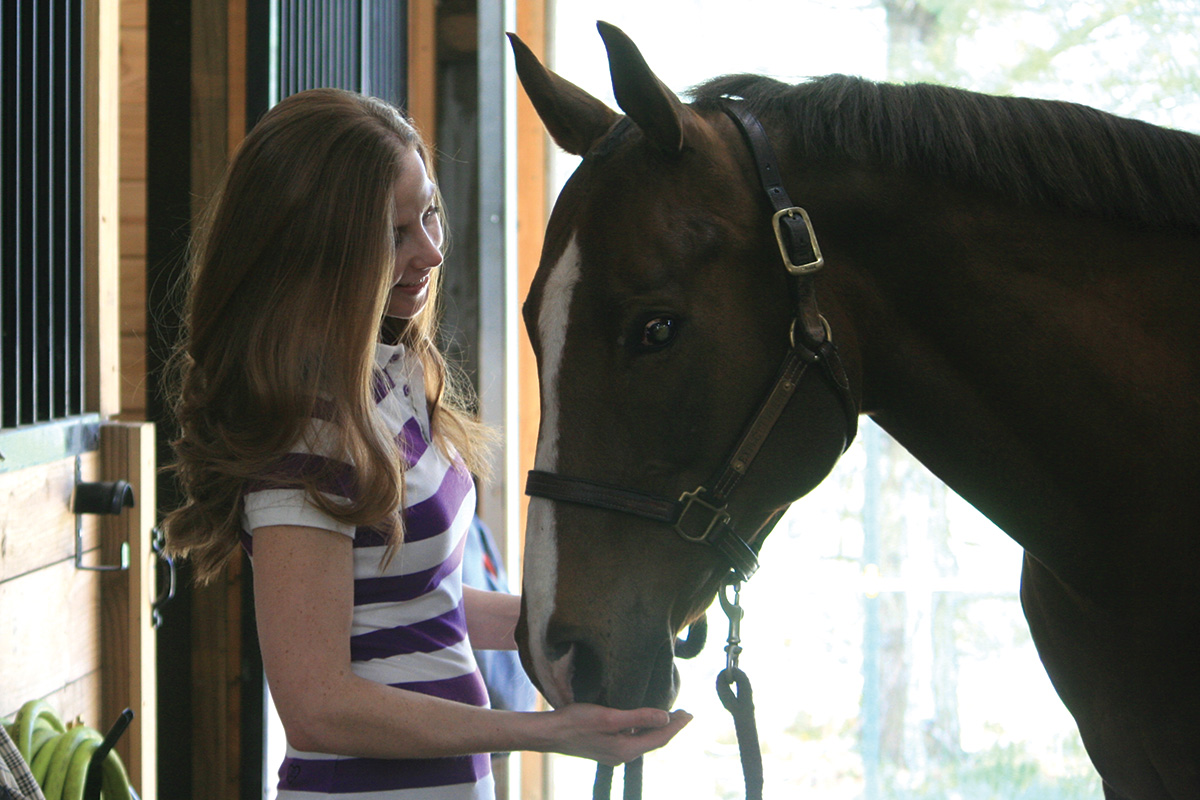 Christine Olsen with her blind horse, Red