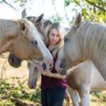 Chelsea Gammon with mustangs from Folly & Friends Mustang Sanctuary