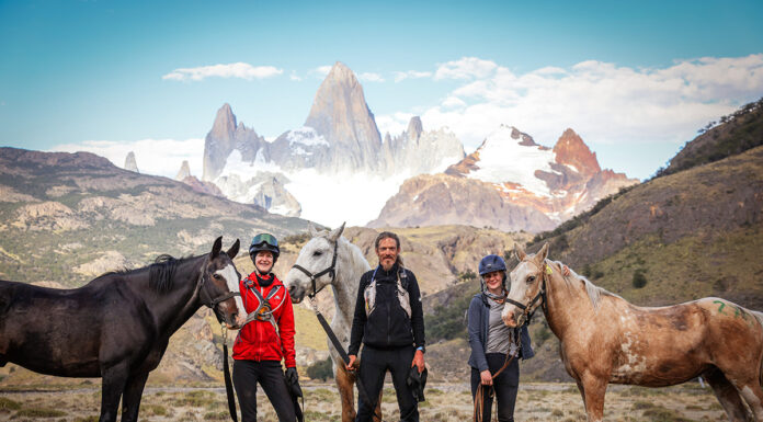 Gaucho Derby winners at the finish line with a Patagonia mountain backdrop