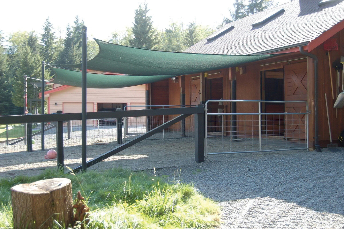 A DIY barn hack to create shade for the barn area with tarps