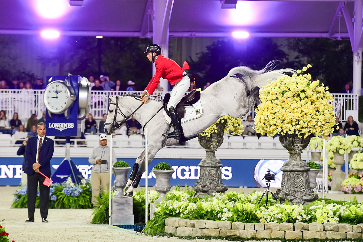 Richard Vogel and Cloudio of the winning German Team sky the water jump during the 2026 LLN Ocala.