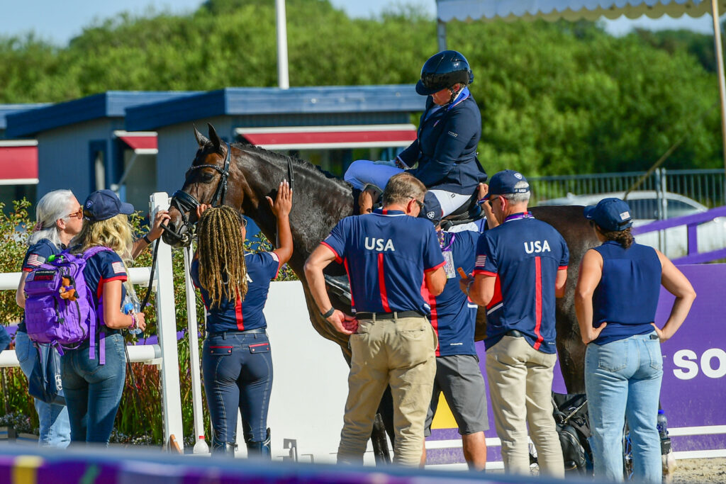 U.S. Para-Dressage Team staff and supporters surround Beatrice de Lavalette and Sixth Sense after their Grade II team test on Friday.