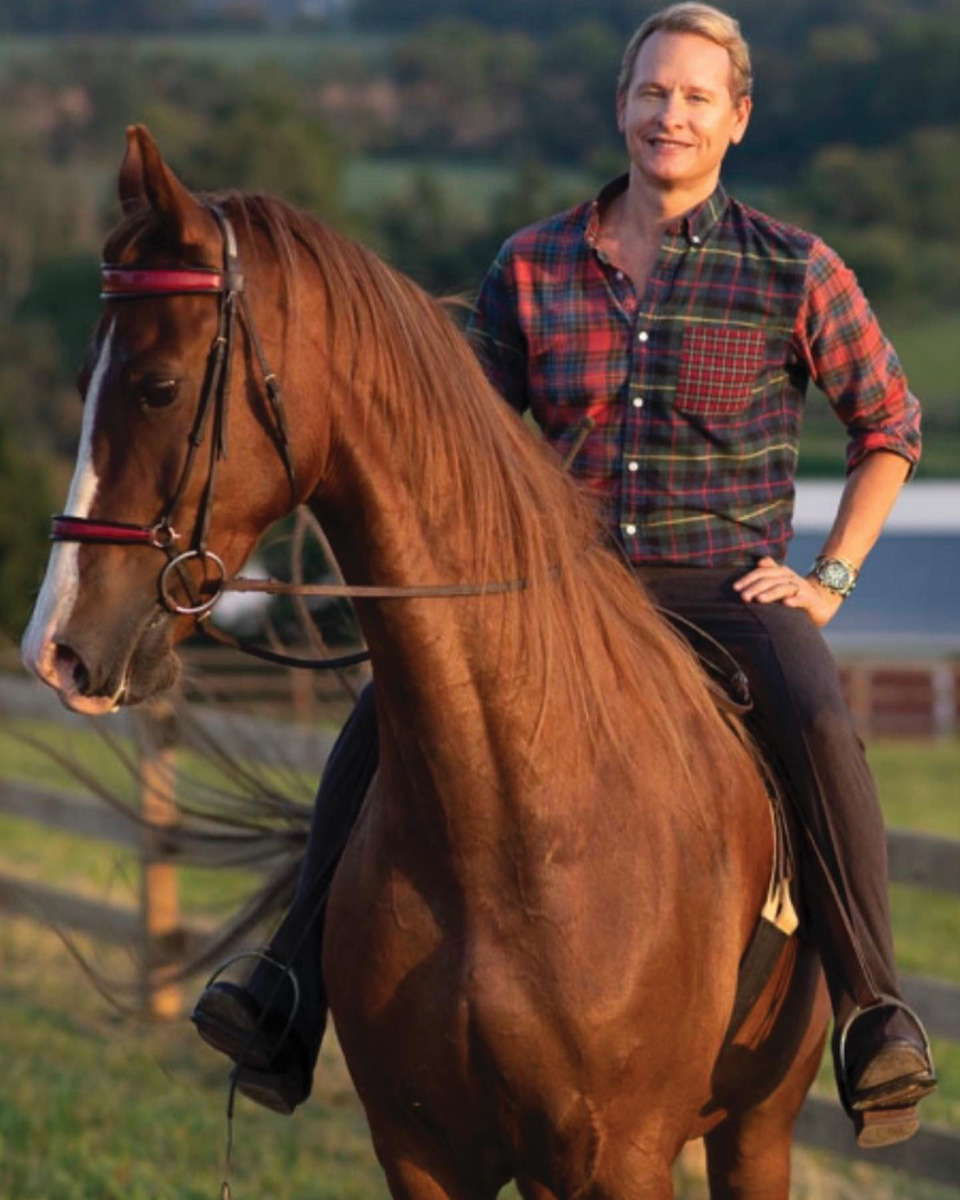 Carson Kressley riding a chestnut Saddlebred