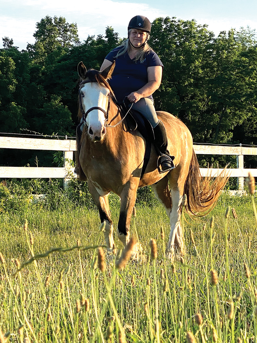 Kitson riding the young Shire gelding.