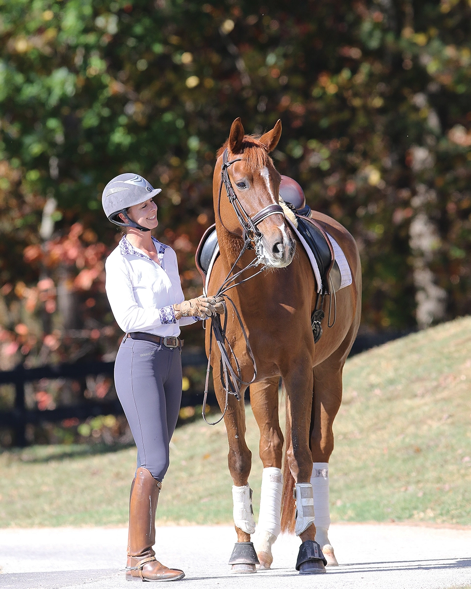 The equestrian poses with the Hanoverian mare Summersby.