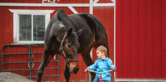 Glenn on his tricycle alongside Twizzler.