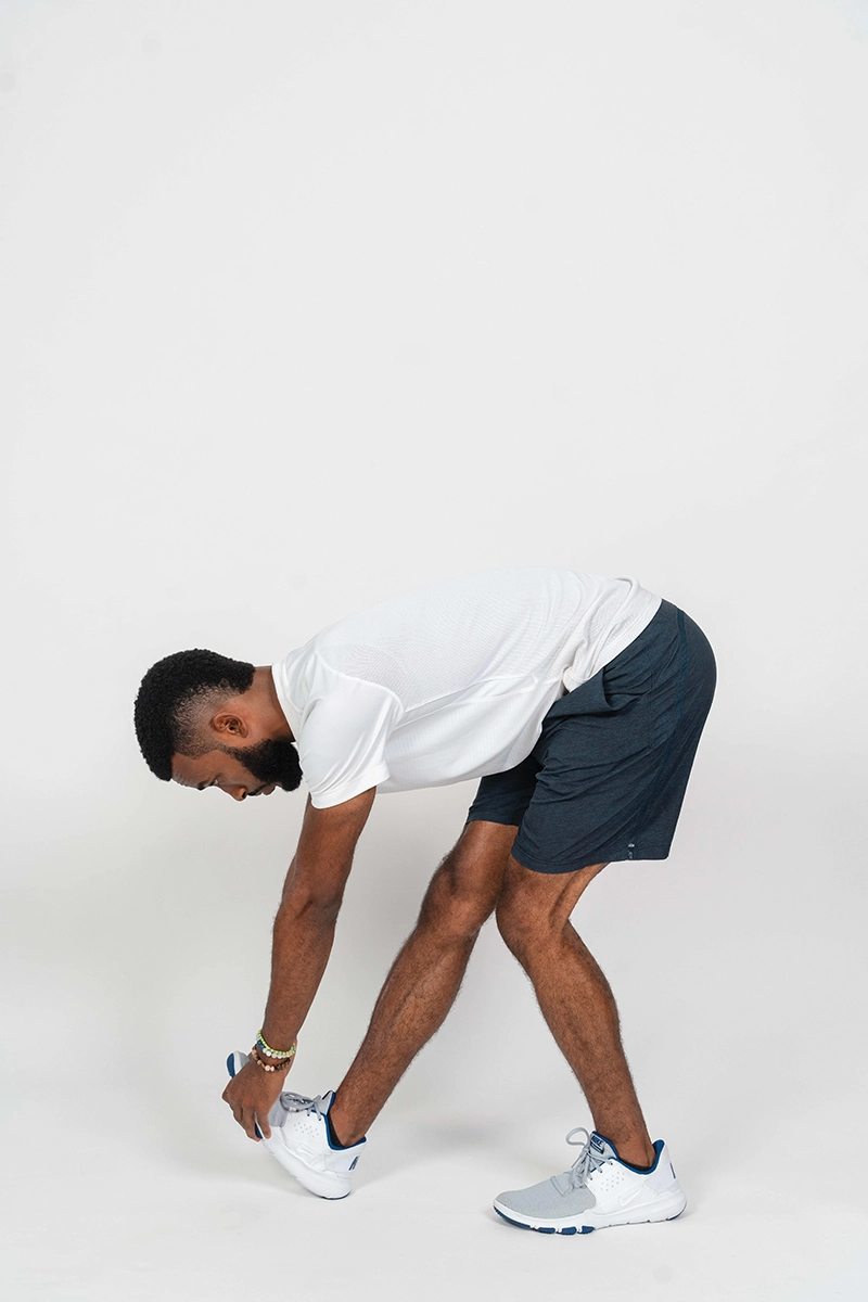 Ifa demonstrating the standing calf stretch.