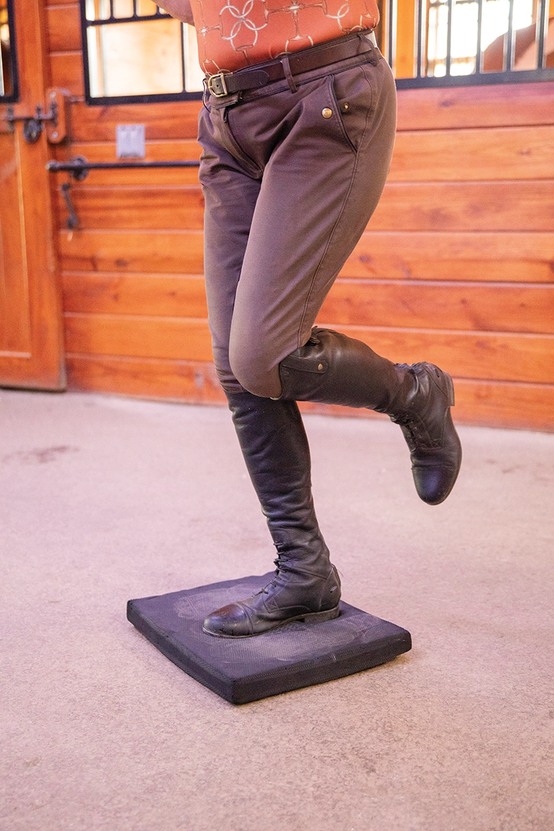 A single-leg stand on a balance pad.