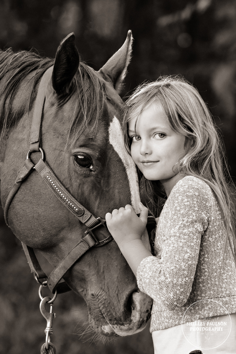 Young girl with horse by Shelley Paulson