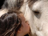 Purina Announces Kick-Off to Senior Horse Tales Online Contest woman kissing horse
