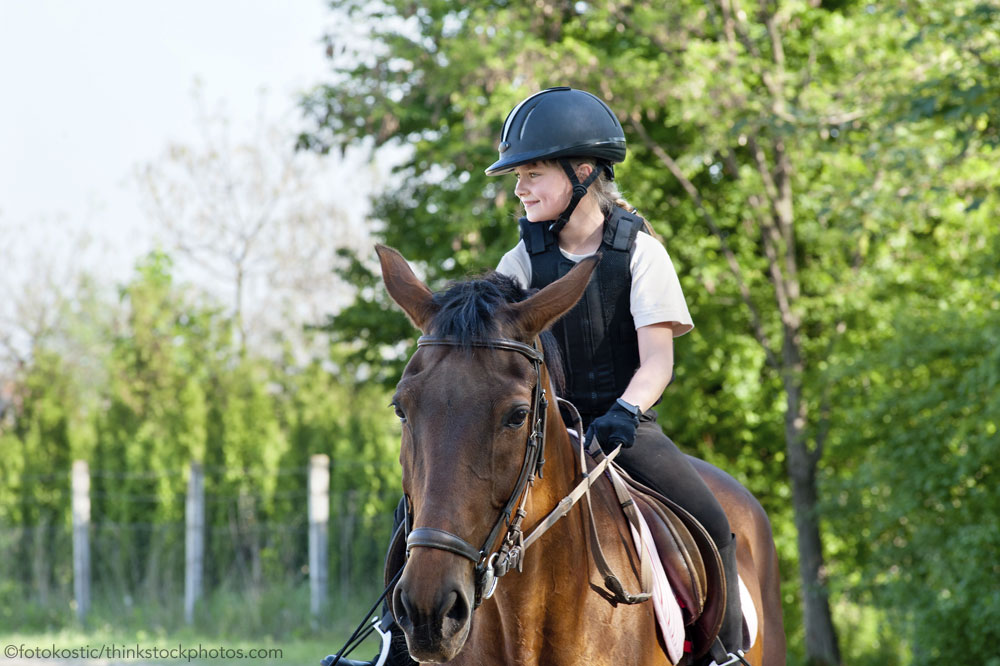 Kid riding a horse