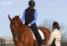 riding instructor talking to a student on horseback