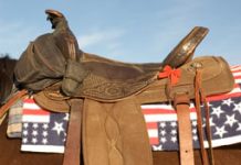Veterans and families ride free at Cheyenne Frontier Days western saddle flag