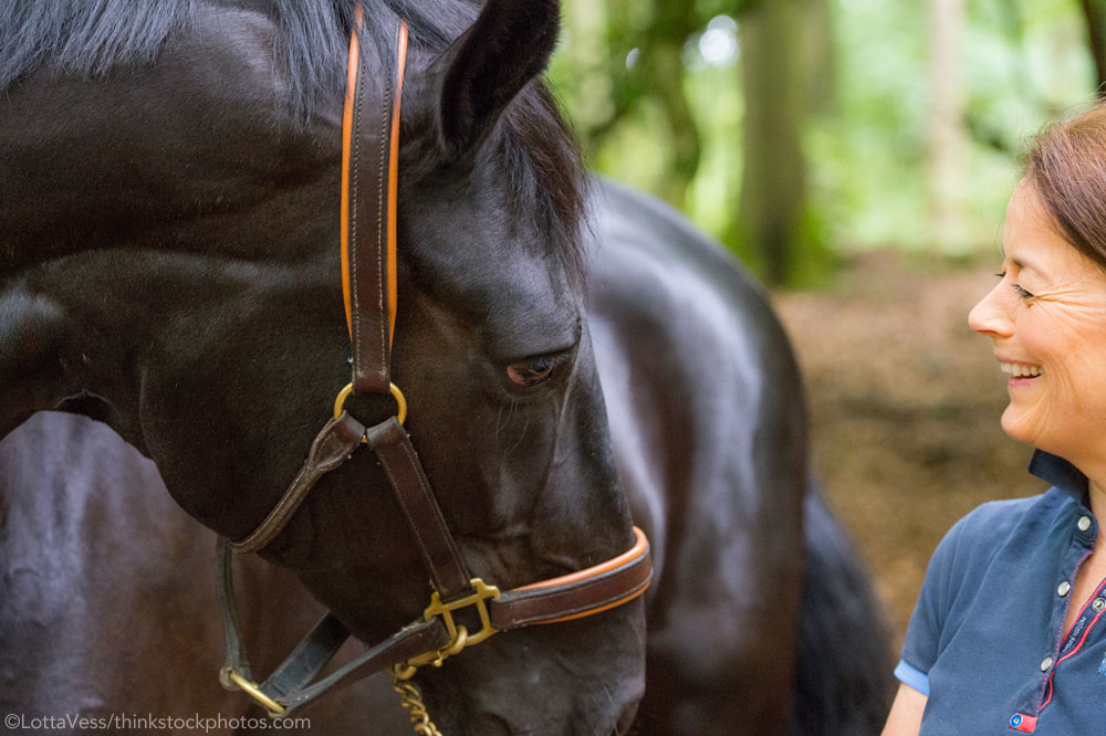 Woman with a black horse