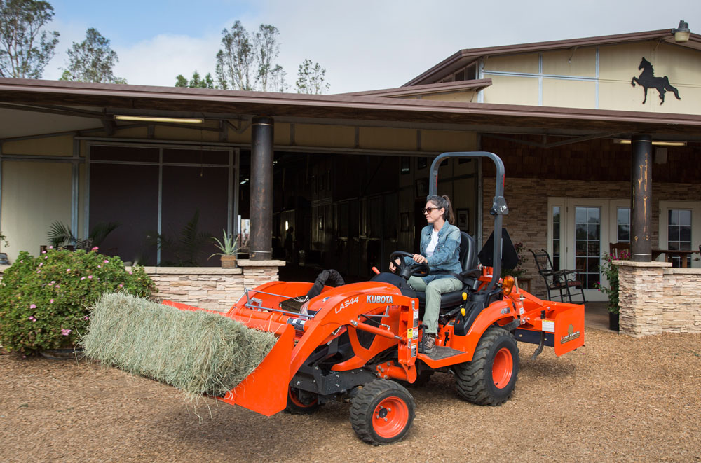 Farm tractor moving hay-barn equipment maintenance