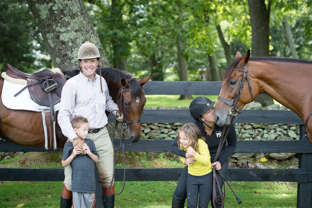 The Mansmann family with two of their Thoroughbreds; OTTB adoptions