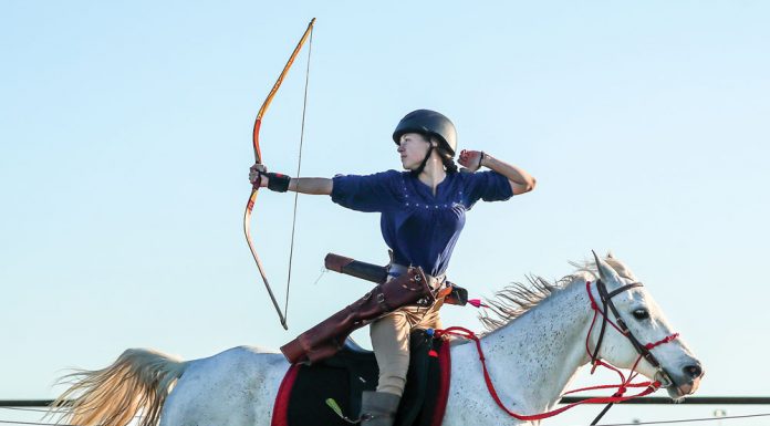 Gracie Waymer practicing mounted archery