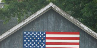Horse barn with American flag