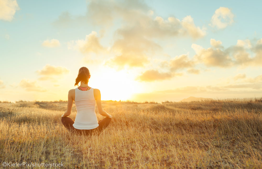 Meditating in a field