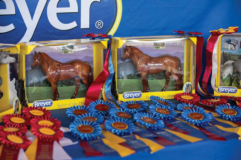 Model horses and championship ribbons at a model horse show