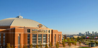 A front view of Dickies Arena in Fort Worth, Texas, with the skyline in the background, where the 2026 FEI Jumping World Cup Finals will take place.