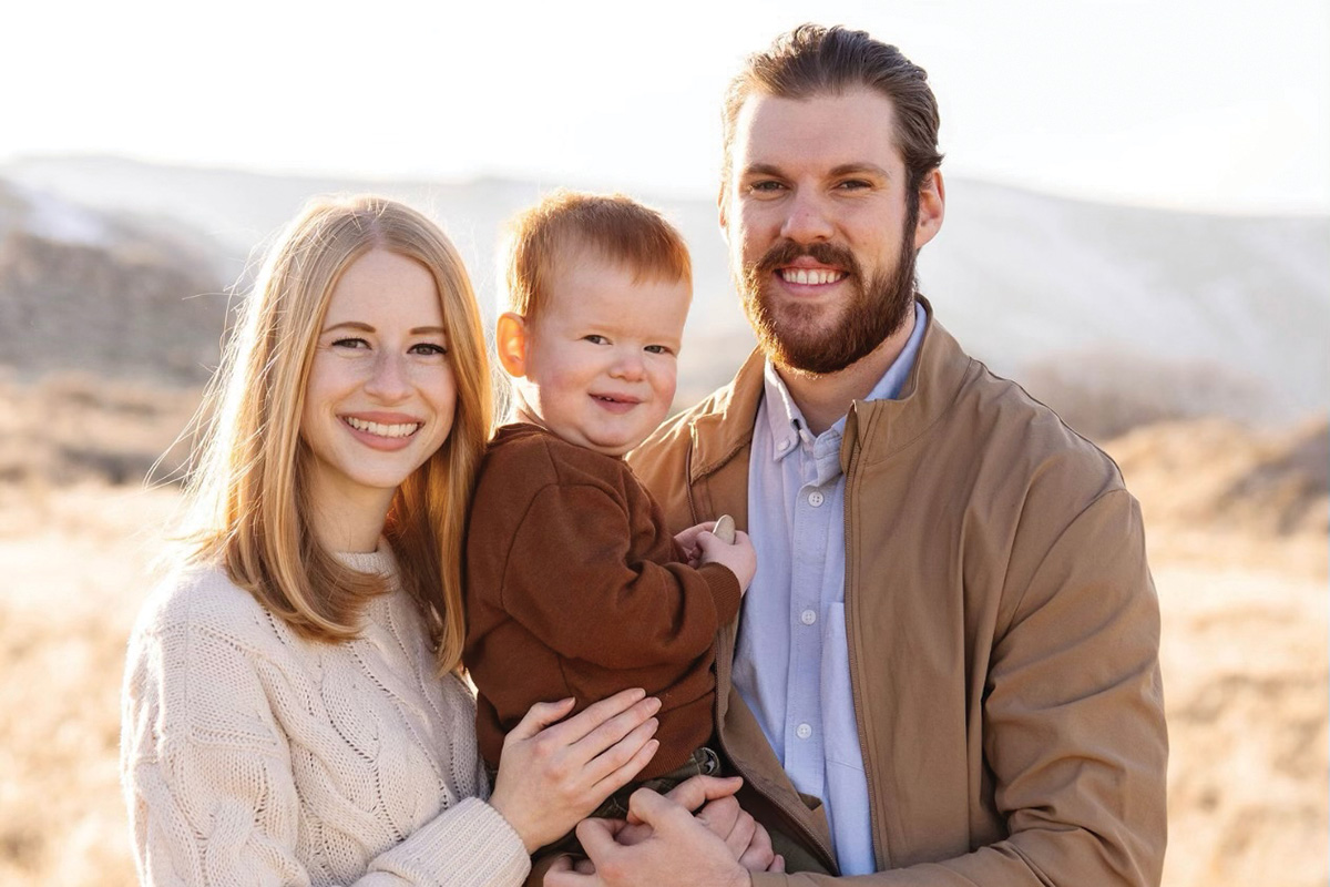 A family portrait of a husband of wife with their young son