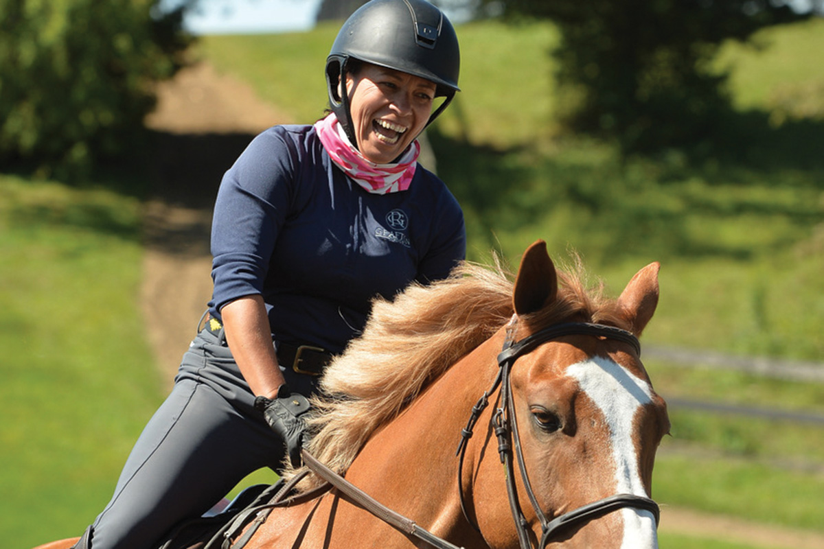 A happy rider on her horse