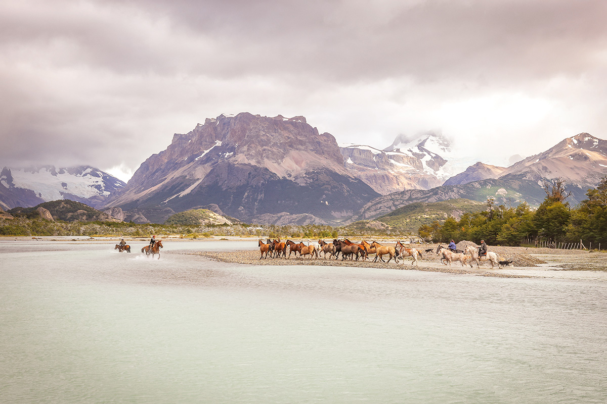 Gauchos working during the Gaucho Derby in a beautiful Patagonia landscape