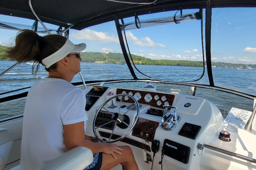 Julie steering her boat