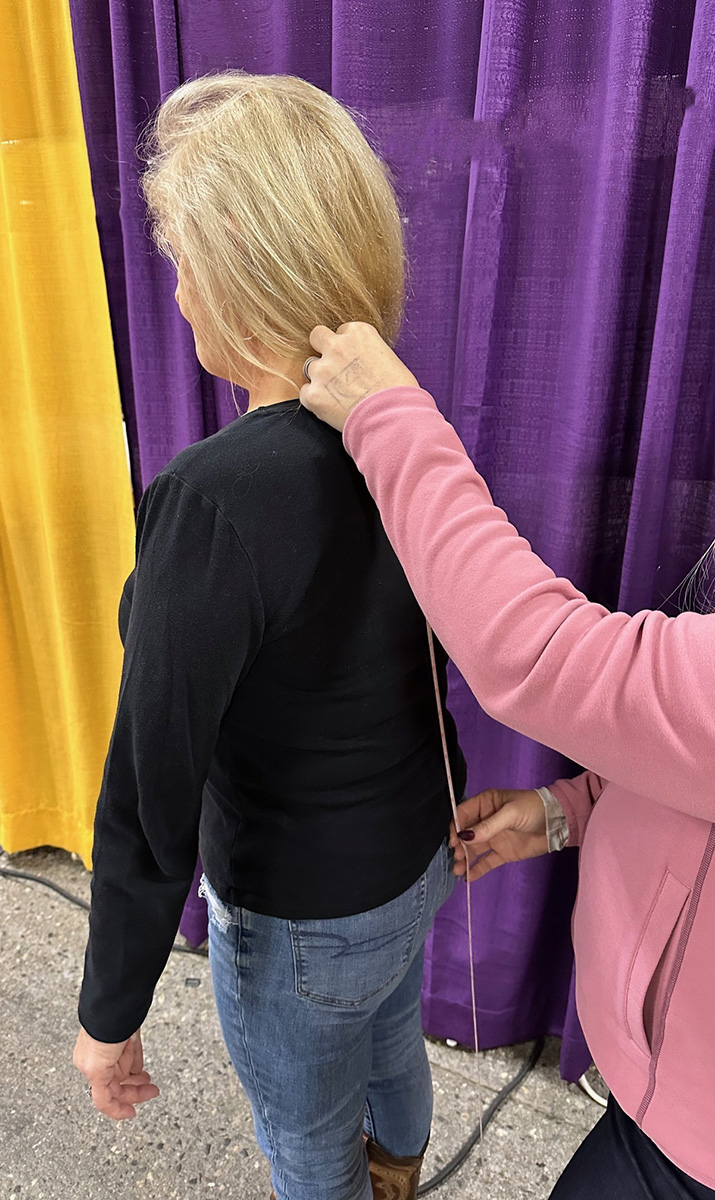 Chick gets the back measurement.