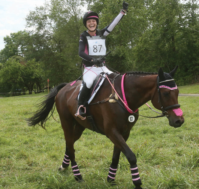 A cross-country rider celebrates.