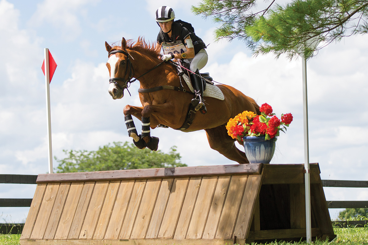 A rider jumps cross-country