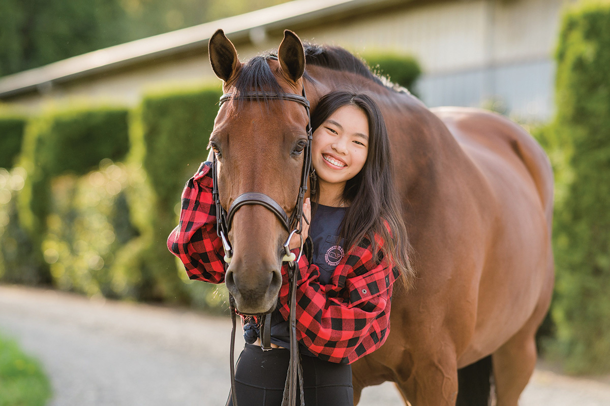 A young girl with her horse