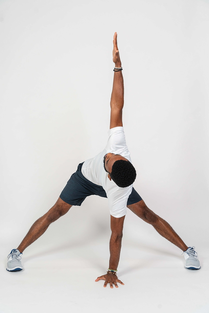 Ifa demonstrating the wide-stance windmill, one of the key mobility exercises for equestrians.