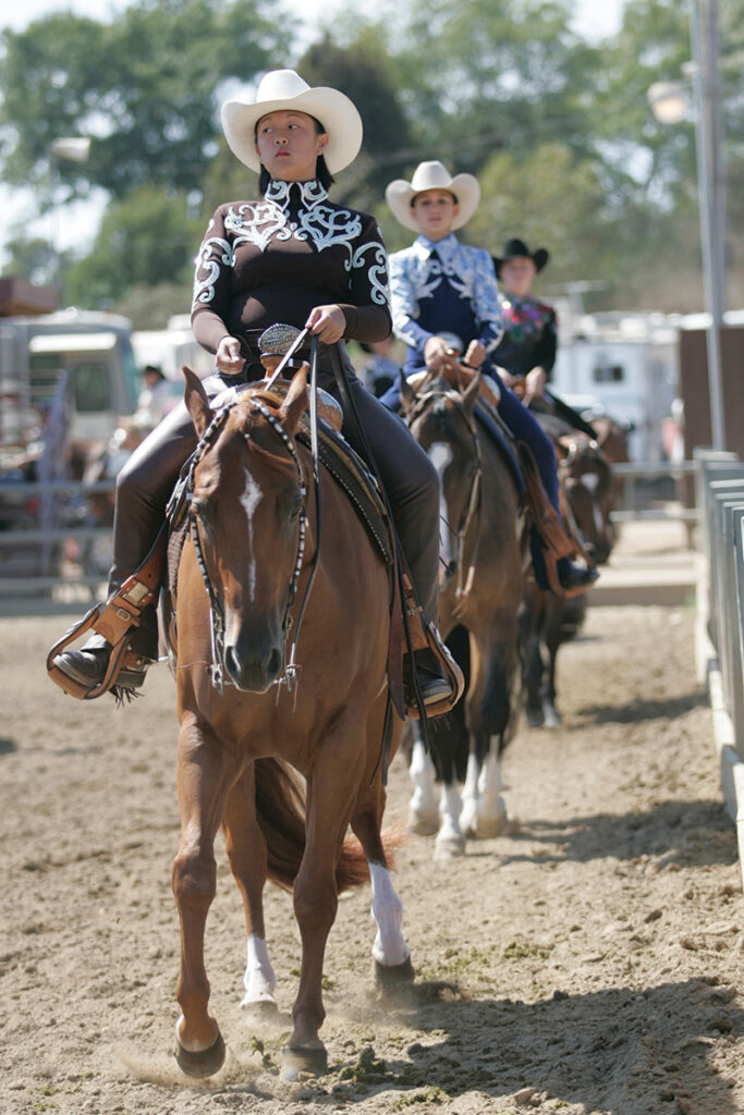 A western rider works to calm her nerves at a horse show