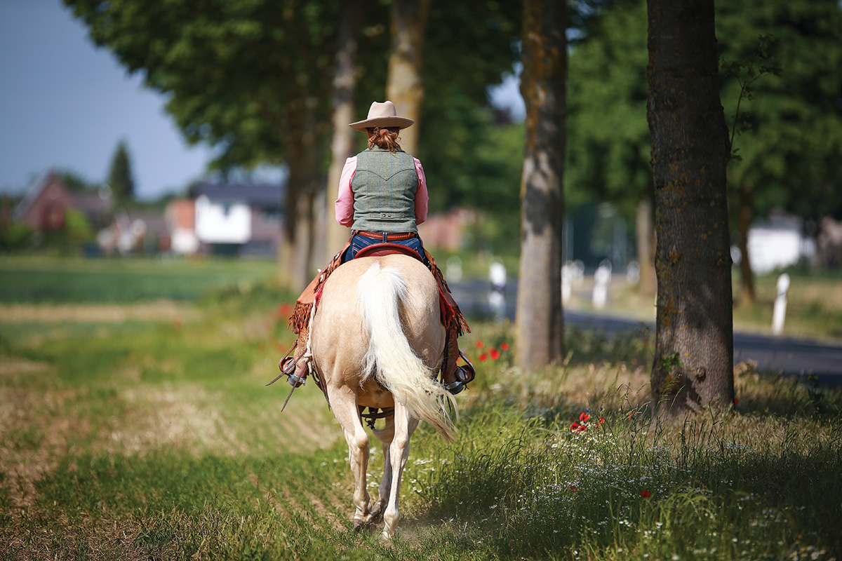 A woman trail riding