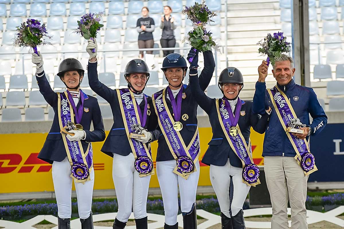 The U.S. Para Dressage team celebrates team gold at the 2026 FEI World Championships in Aachen.