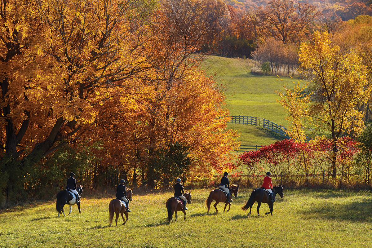 Riders embark on a drag hunt with fall foliage gracing the landscape