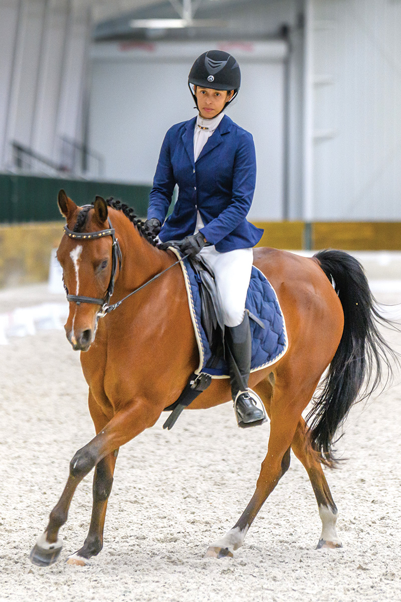 An equestrian of color at a horse show