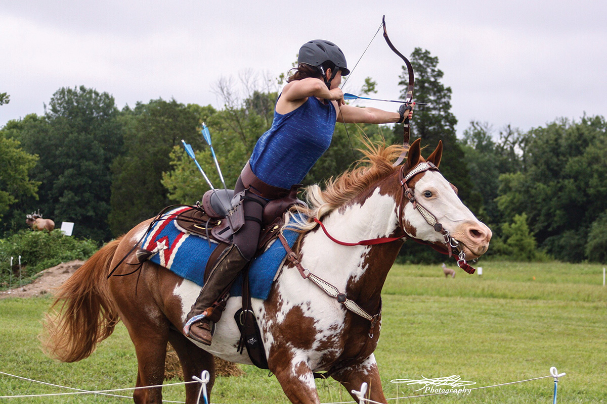 A rider performs mounted archery