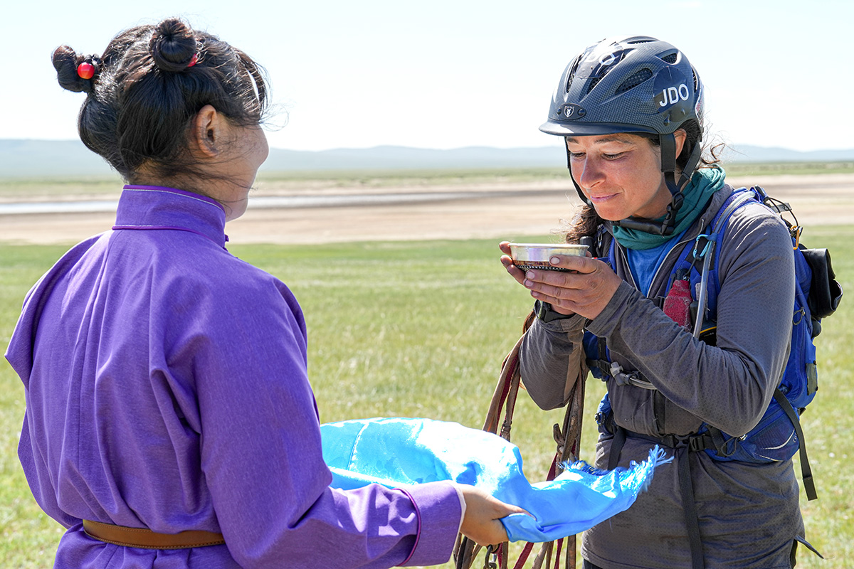 Drinking ceremonial milk at the finish line.