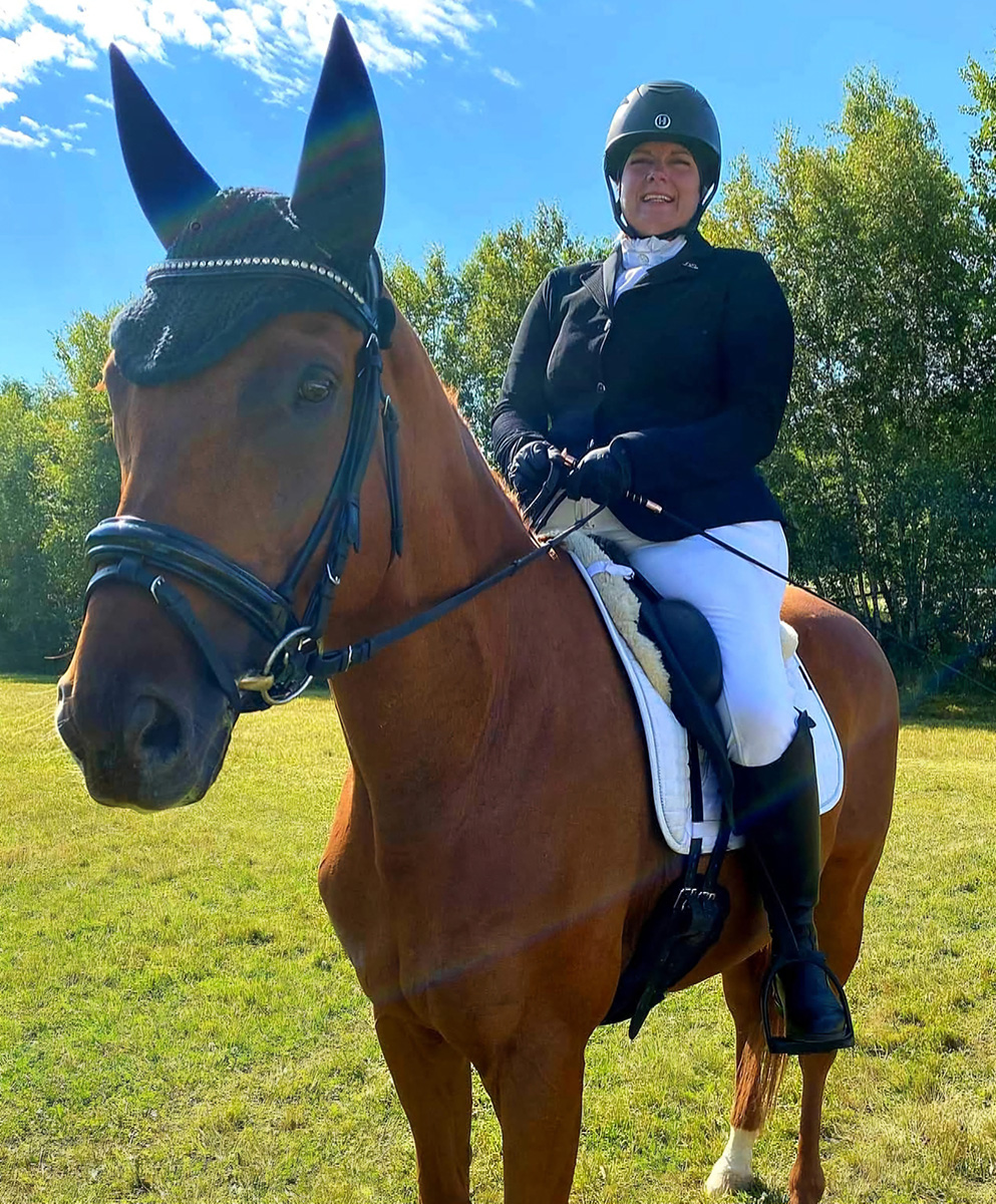 Kara Lawson and her horse, Wallace, at a 2022 USDF show in Maine. 