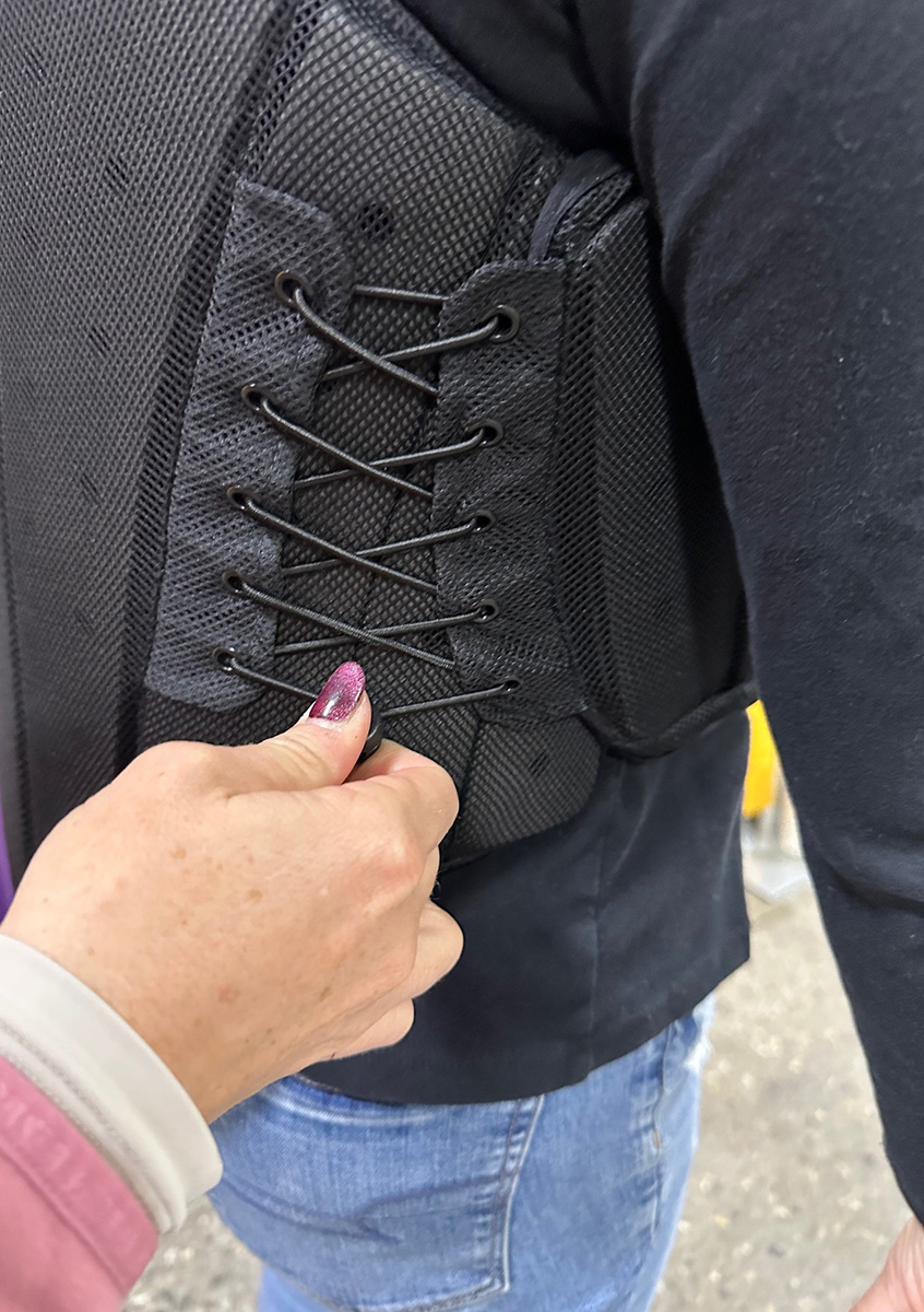 Chick demonstrates how to adjust bungy side fastenings.