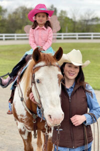 Mother and daughter with their horse