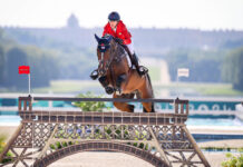 Laura Kraut (USA) and Baloutinue clear the Eiffel Tower jump with the backdrop of Palace of Versailles — a summary of the Paris 2024 Olympic equestrian setting