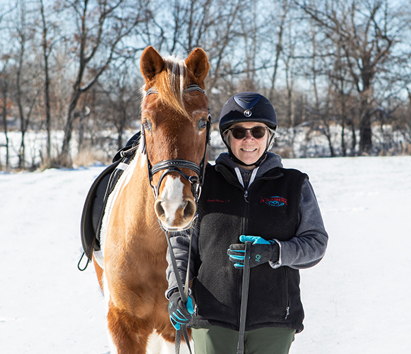 winter riding goals with your horse - Andrea Becker with her horse, Skittles
