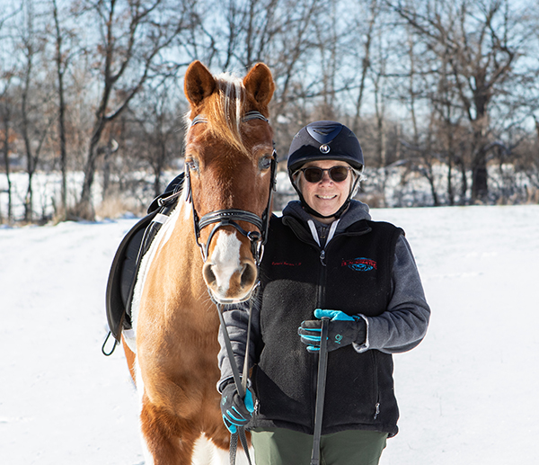 winter riding goals with your horse - Andrea Becker with her horse, Skittles